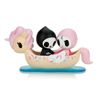 Boatload of Love figure design of Adios and Ciao Ciao holding hands while sitting in a donut Unicorno-themed boat. This is the series' chaser design.
