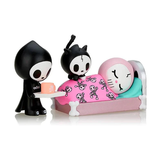 Lovesick figure design of Adios taking care of Ciao Ciao who is sick in bed. Their pet Skeletrino is sitting on top of Ciao Ciao.