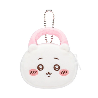 Plush Chiikawa purse with an embroidered face and pink handle.