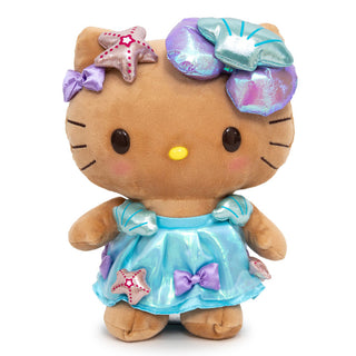 Standing Tan Hello Kitty Plush wearing a blue summer dress with shiny bows and seashells