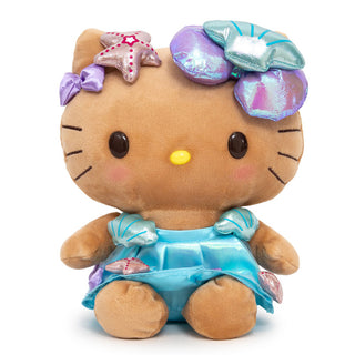 Sitting Tan Hello Kitty Plush wearing a blue summer dress with shiny bows and seashells