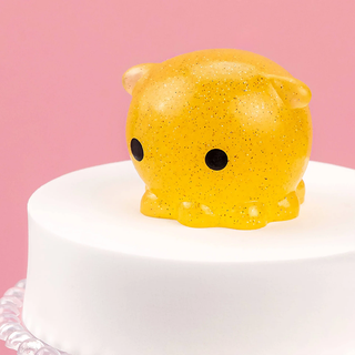 Glittery yellow octopus squishy.
