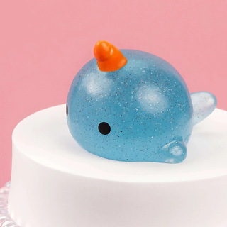 Glittery blue narwhal squishy.