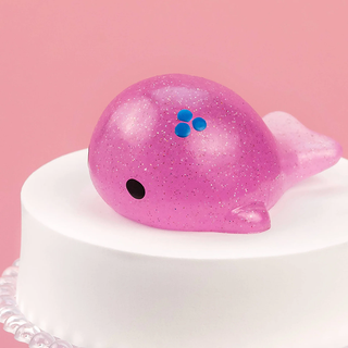 Glittery purple whale squishy.