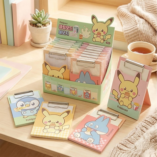 The box display of the Pokemon clipboards in their packaging with some clipboards without without the packaging in the foreground.