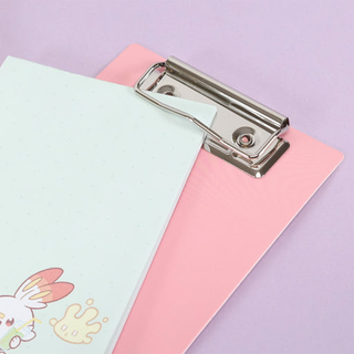 A close up of the top of the clipboard which clips memo pad in place.